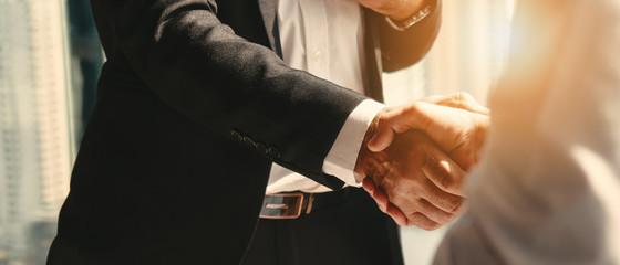 Handshake confirming a new fractional CFO engagement with Rossenrode Partners